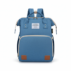 Sac à Dos à Langer 3-en-1 – Lit de Voyage, Imperméable, Charge USB, 7 Compartiments, Compatible Poussette | TrioNest™